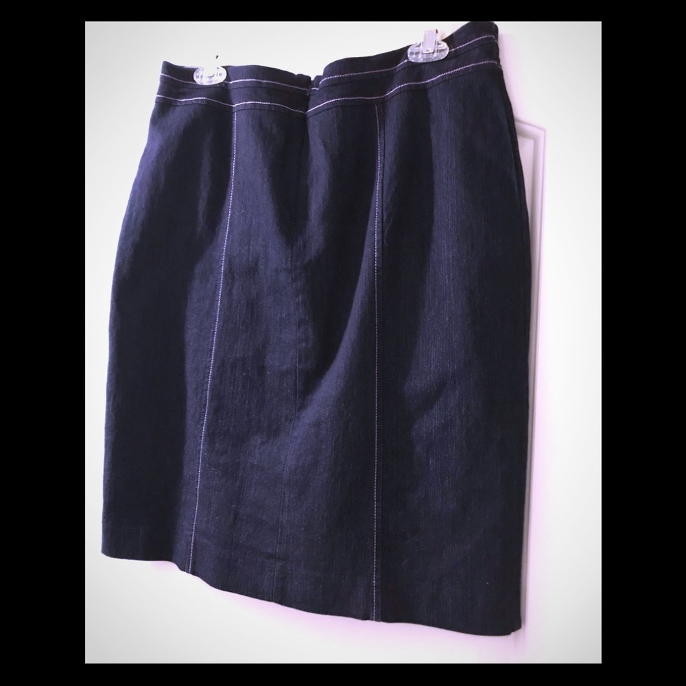 Jean skirt with pink stitching.